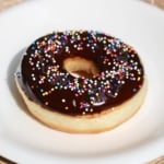 Did you know you can make fluffy and delicious yeasted doughnuts in a bread machine? These homemade doughnuts are going to knock your socks off! Glazed, dipped into chocolate, or covered in cinnamon sugar, do what you want! Go nuts with your doughnuts! #donuts #doughnuts #fluffy #homemade #yeasted #glazed #chocolate #sprinkles #doughnutholes #timbits #dunkindonuts #krispykreme #timhortons #breadmachines #fried