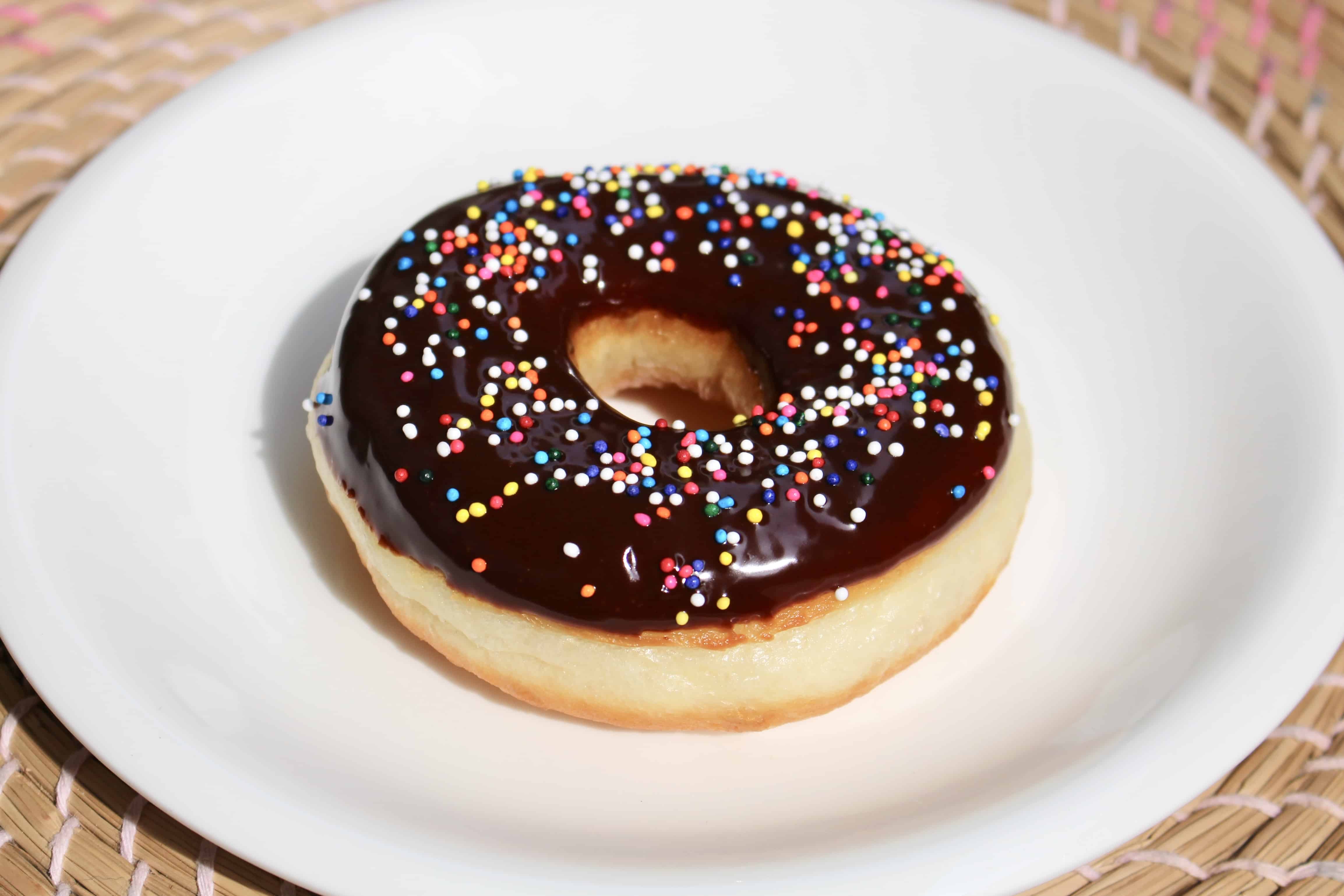 Did you know you can make fluffy and delicious yeasted doughnuts in a bread machine? These homemade doughnuts are going to knock your socks off! Glazed, dipped into chocolate, or covered in cinnamon sugar, do what you want! Go nuts with your doughnuts! #donuts #doughnuts #fluffy #homemade #yeasted #glazed #chocolate #sprinkles #doughnutholes #timbits #dunkindonuts #krispykreme #timhortons #breadmachines #fried