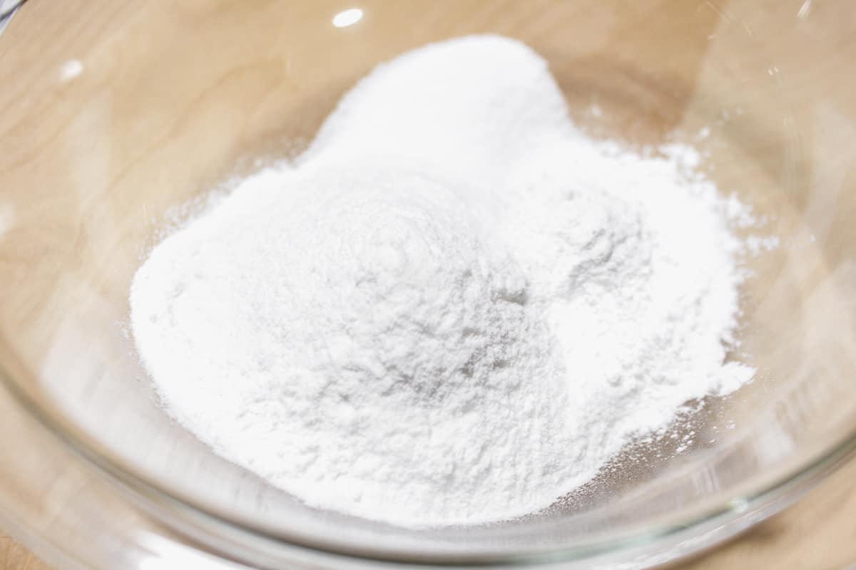 Dry ingredients for mochi added to a bowl.