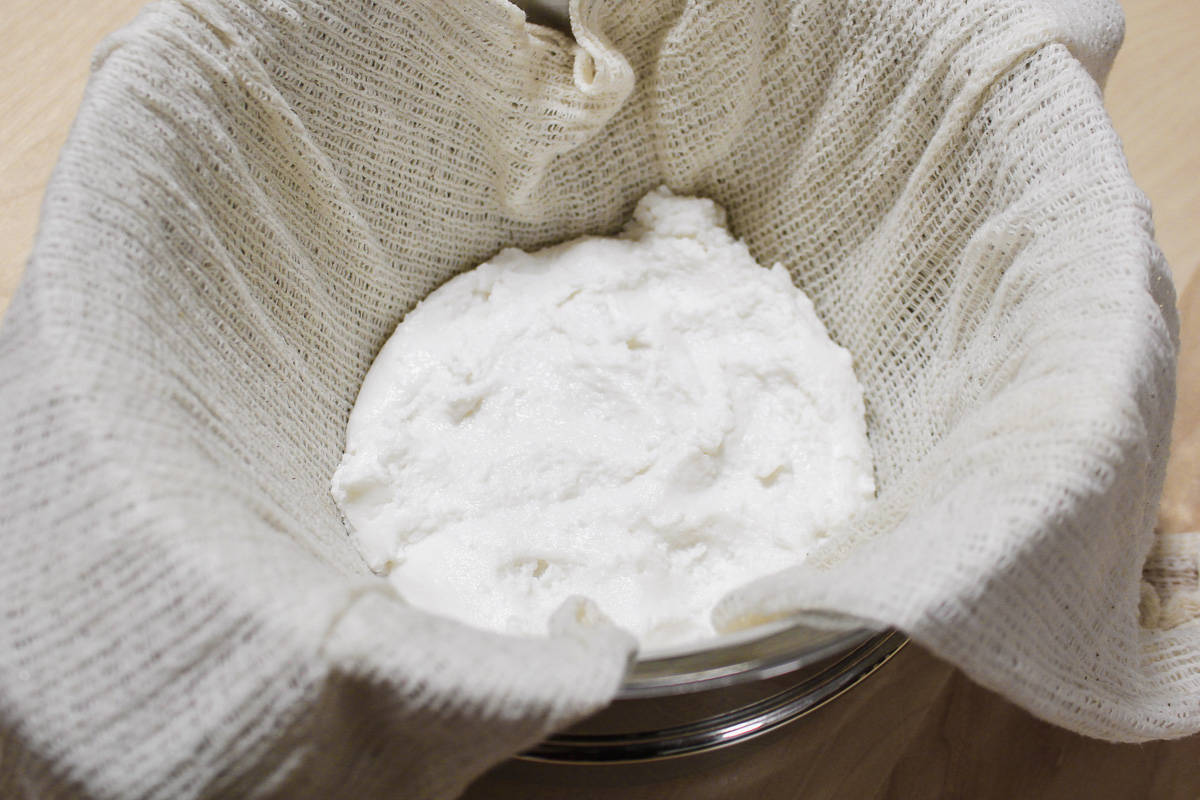 Steaming the mochi dough in a cheesecloth lined pan.