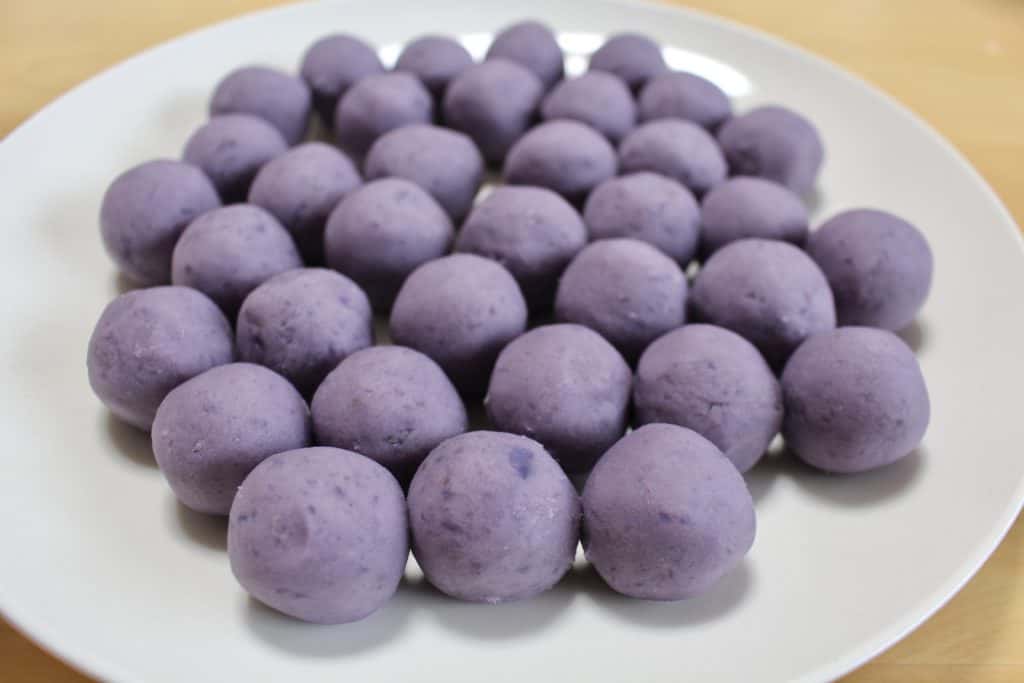 Purple sweet potato balls to be covered with white chocolate