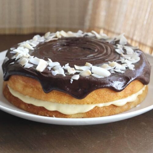 coconut boston cream pie on a plate.