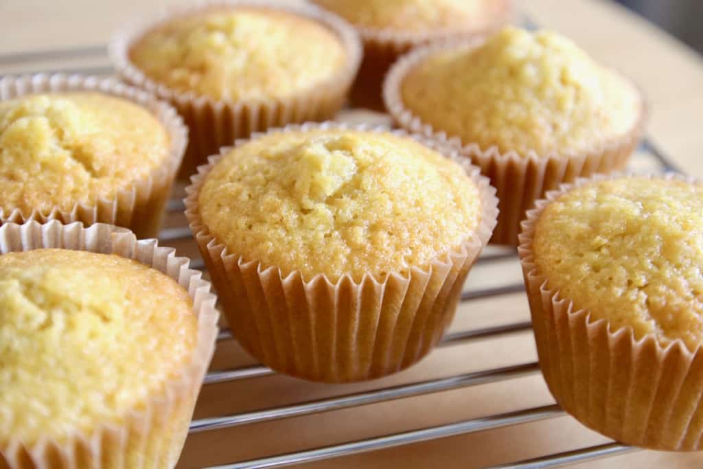Cupcakes baked and cooling on a wire rack