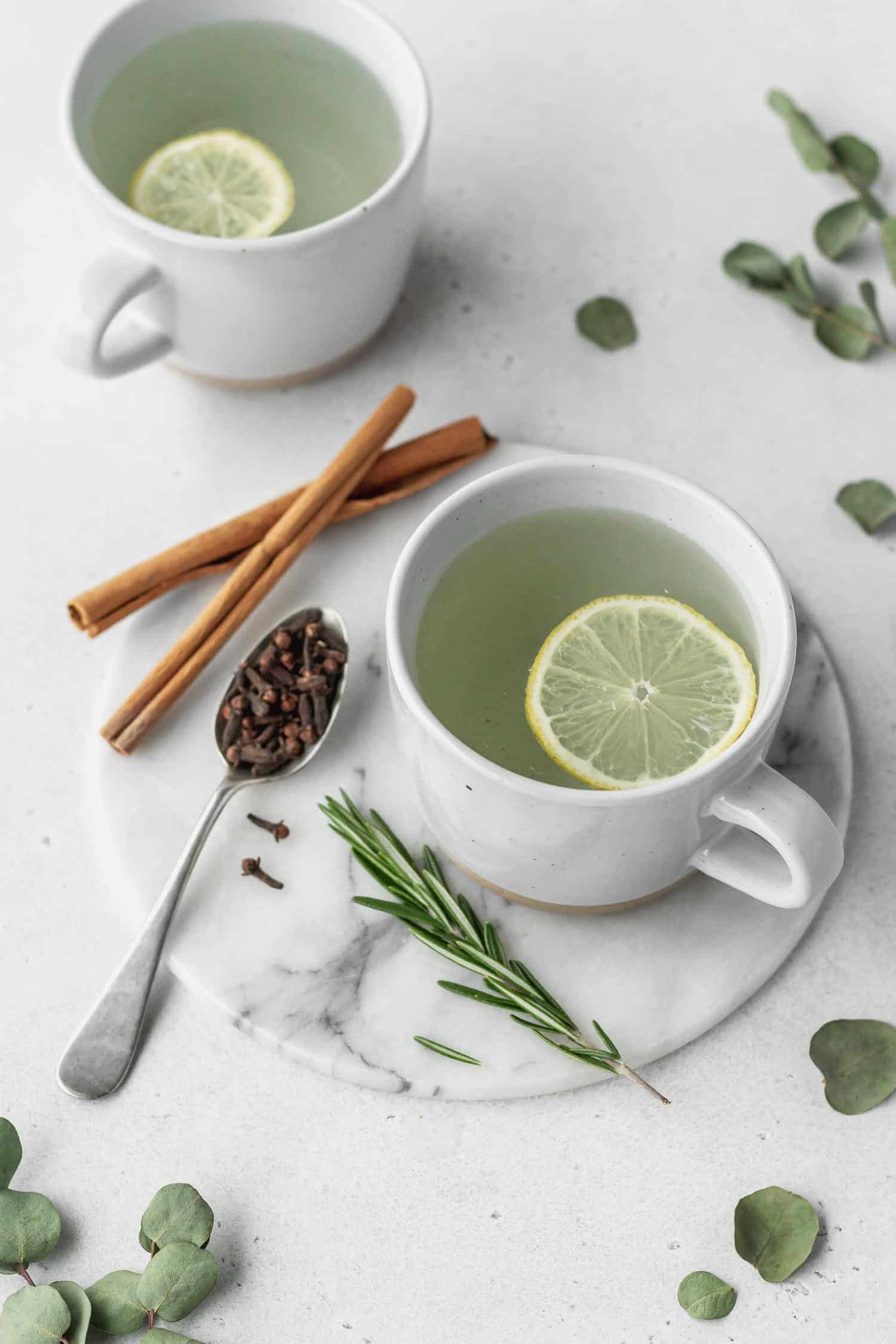 Thieves tea in a mug with a lemon slice