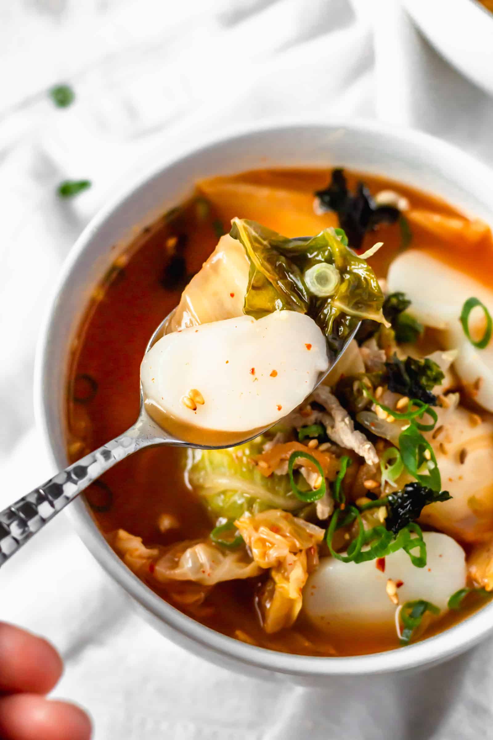 Kimchi soup with Korean tteok rice cakes is spicy, easy, and delicious! #kimchisoup #probiotics #spicysoup #Koreanfood #healthymeals