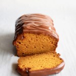 A loaf of Brazilian carrot cake with chocolate frosting.