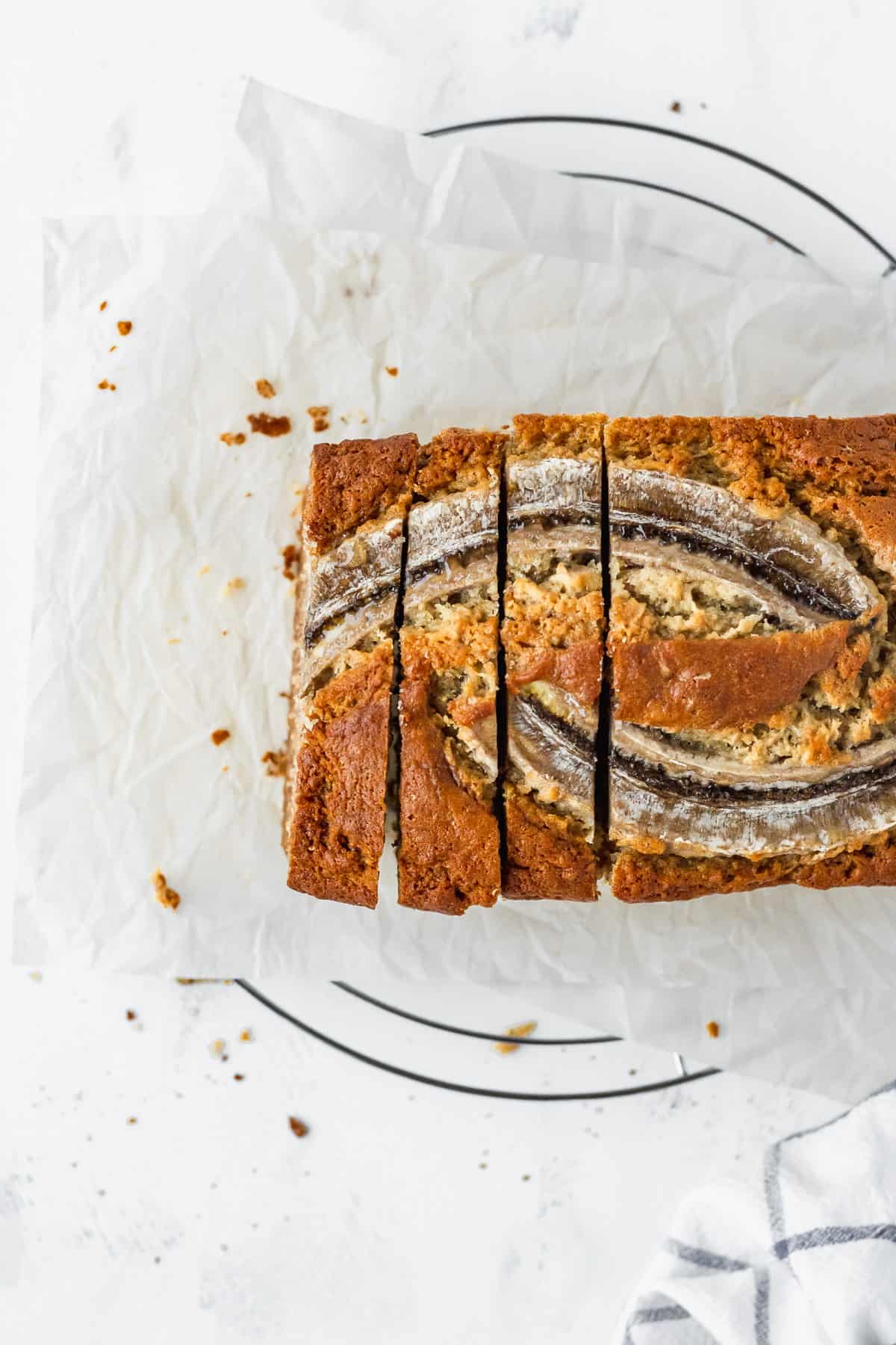 An overhead shot of super moist banana bread that's been sliced.