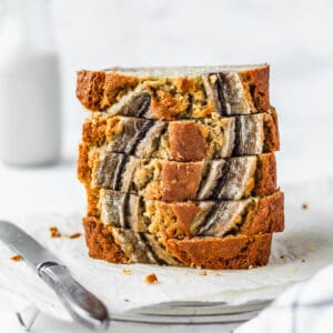 A stack of moist banana bread with a white background.