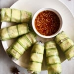 Need a fresh and light appetizer? These spicy chicken summer rolls are perfect! Moist and flavorful chicken is wrapped in rice paper with lettuce and cucumber, served with a spicy Sichuan dipping sauce! #summerrolls #springrolls #ricepaper #chicken #chickenthigh #chinese #sichuan #spicy #healthy #lettucewraps #appetizer #fresh #light #partyfood #asian