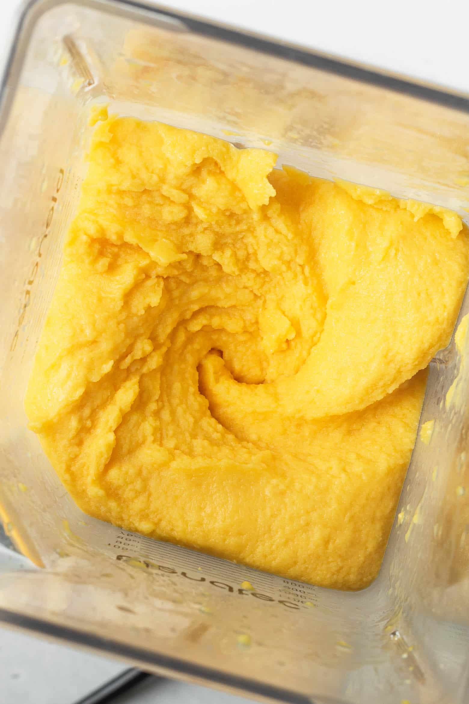 Blended mango sorbet in a blender
