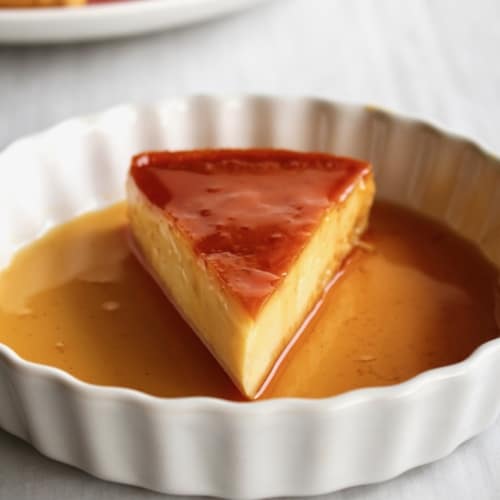Leche flan is easily my favorite Filipino dessert! The custard is so creamy, rich, and absolutely delicious! This is a dairy-free version, using condensed coconut milk and evaporated coconut milk! #lecheflan #filipino #pinoy #philippines #custard #cremecaramel #caramel #eggs #dairyfree #glutenfree #vegetarian #coconut #coconutmilk #condensedmilk #evaporatedmilk
