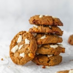 A stack of chai cookies on parchment paper.