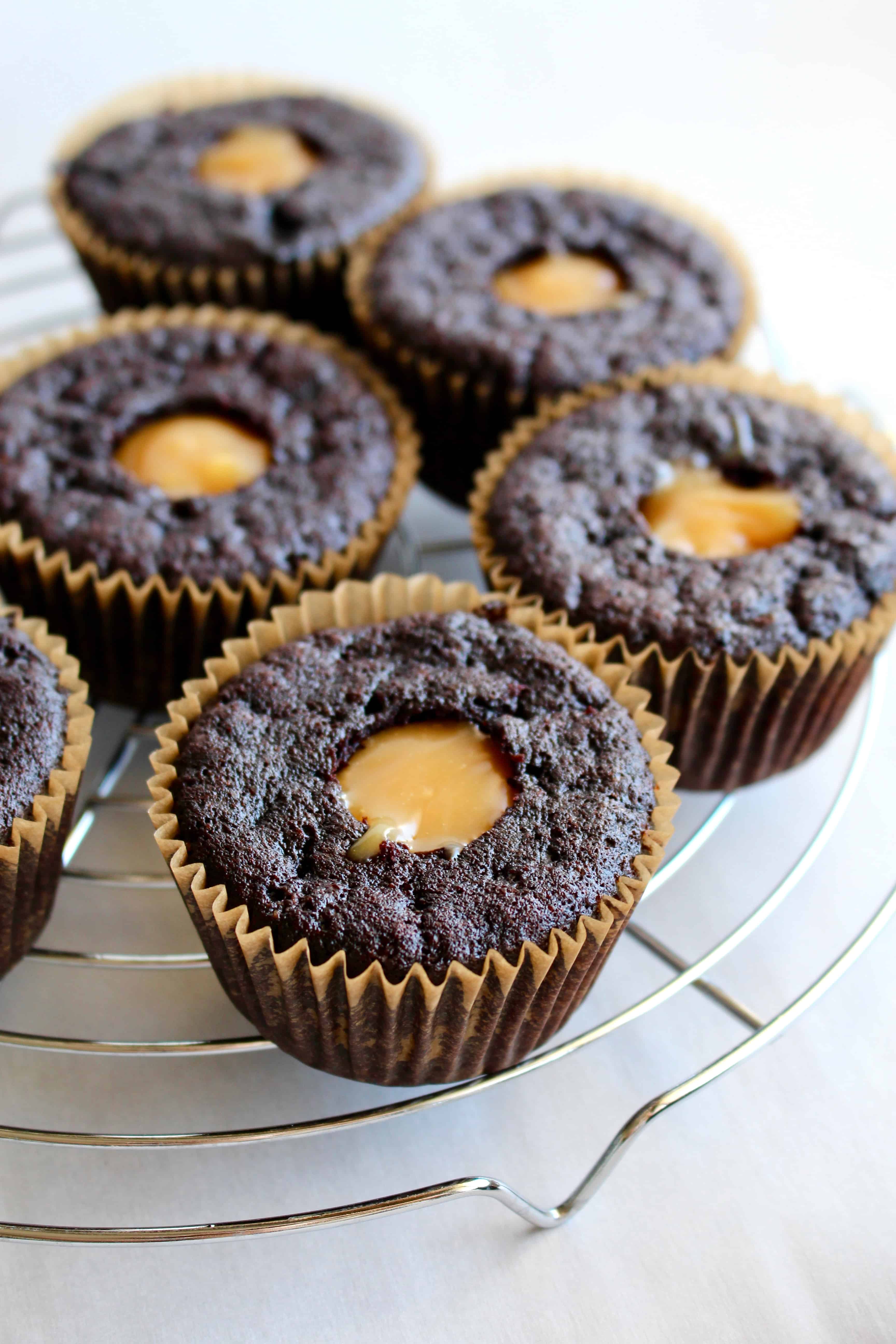Chocolate cupcakes filled with vegan caramel sauce.