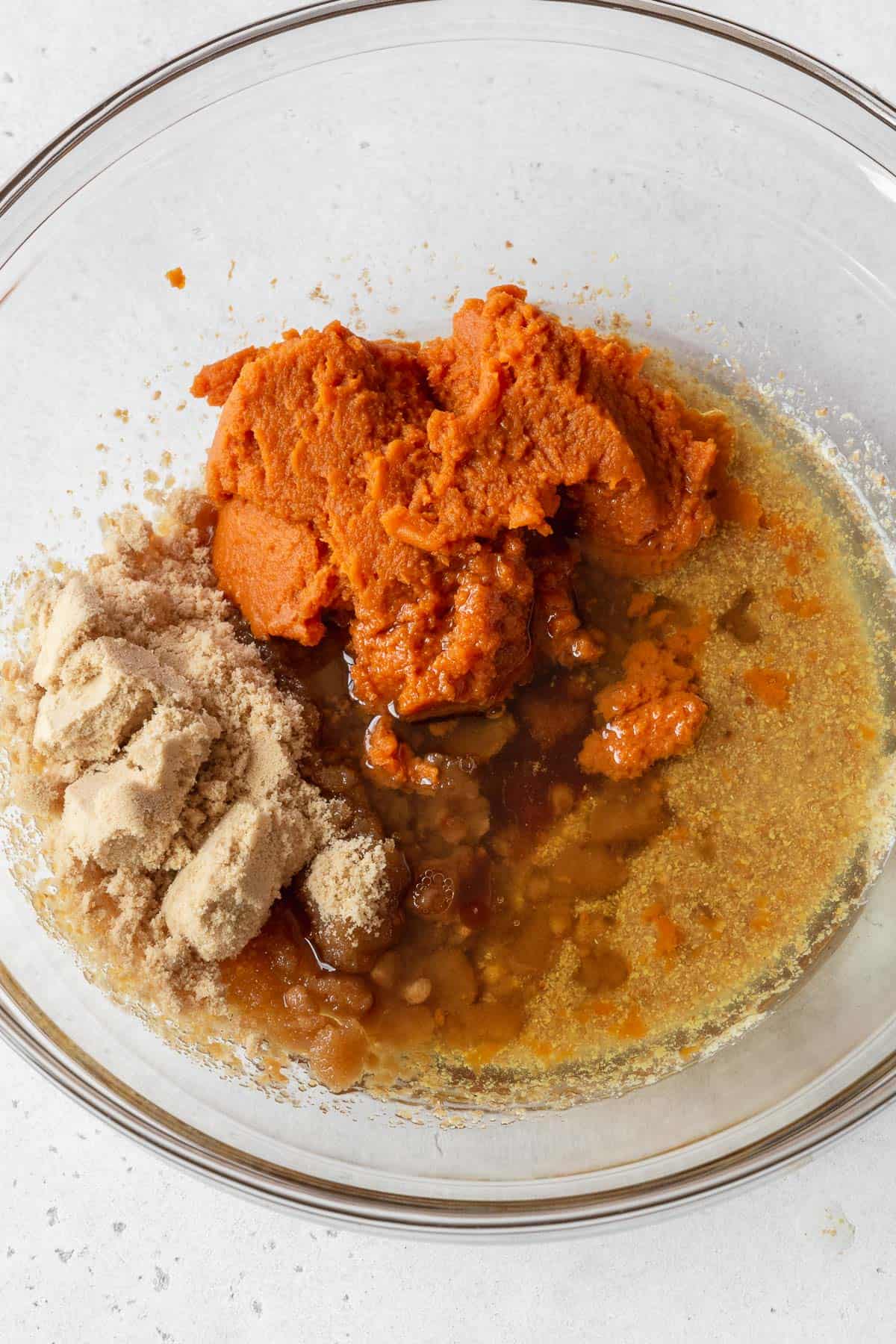 Process shot - wet ingredients and sugar added to bowl with the flax egg.