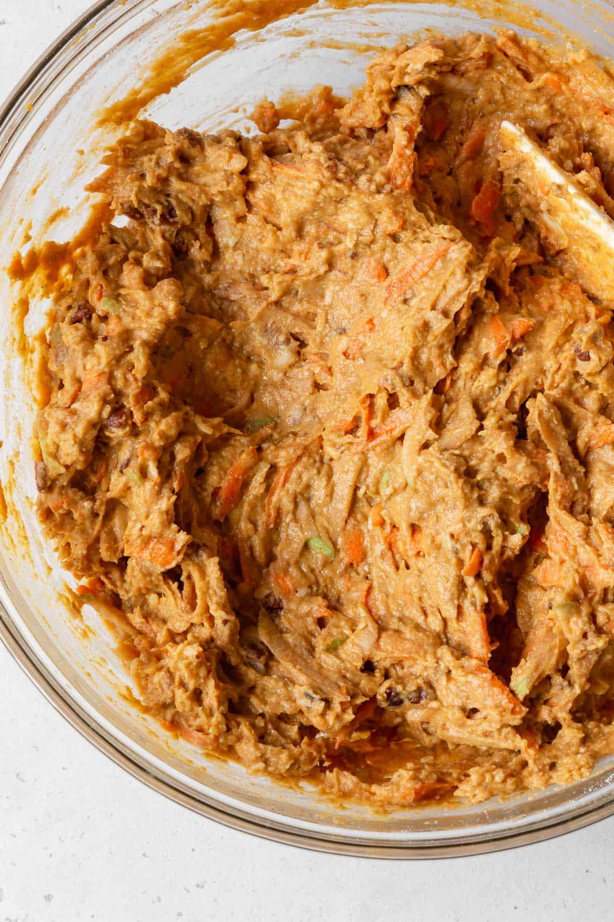 Process shot - healthy morning glory pumpkin muffin batter in a bowl after combining.