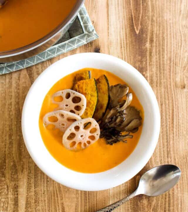 Vegan coconut curry is creamy, spicy, and is sure to keep you warm this winter! Full of vegetables, it’s so much better tasting, and better for you, than takeout! #vegan #coconutmilk #coconutcurry #curry #indiancurry #thaicurry #winter #rootvegetables #vegetables #delicious #comfortfood #recipe #spicy #creamy #glutenfree #lotusroot #kabocha #maitake #mushrooms