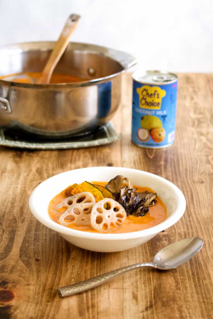 Vegan coconut curry is creamy, spicy, and is sure to keep you warm this winter! Full of vegetables, it’s so much better tasting, and better for you, than takeout! #vegan #coconutmilk #coconutcurry #curry #indiancurry #thaicurry #winter #rootvegetables #vegetables #delicious #comfortfood #recipe #spicy #creamy #glutenfree #lotusroot #kabocha #maitake #mushrooms