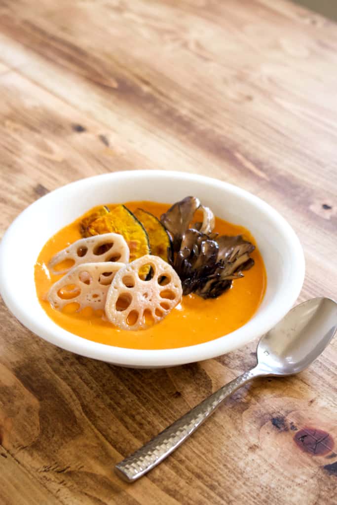 Vegan coconut curry is creamy, spicy, and is sure to keep you warm this winter! Full of vegetables, it’s so much better tasting, and better for you, than takeout! #vegan #coconutmilk #coconutcurry #curry #indiancurry #thaicurry #winter #rootvegetables #vegetables #delicious #comfortfood #recipe #spicy #creamy #glutenfree #lotusroot #kabocha #maitake #mushrooms