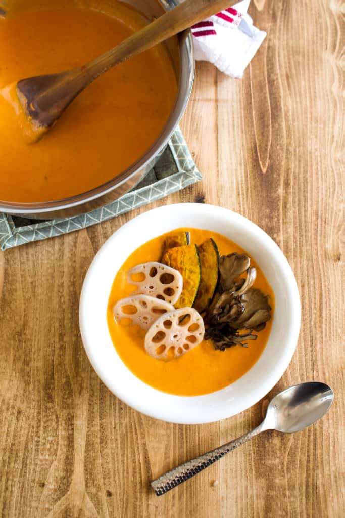 Vegan coconut curry is creamy, spicy, and is sure to keep you warm this winter! Full of vegetables, it’s so much better tasting, and better for you, than takeout! #vegan #coconutmilk #coconutcurry #curry #indiancurry #thaicurry #winter #rootvegetables #vegetables #delicious #comfortfood #recipe #spicy #creamy #glutenfree #lotusroot #kabocha #maitake #mushrooms