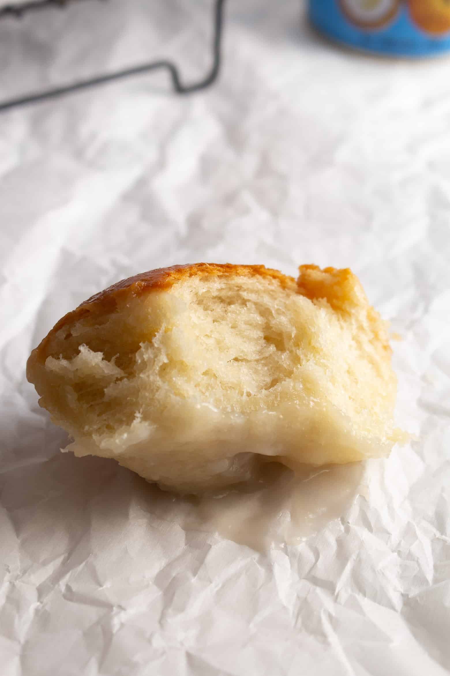 A bitten dinner roll.