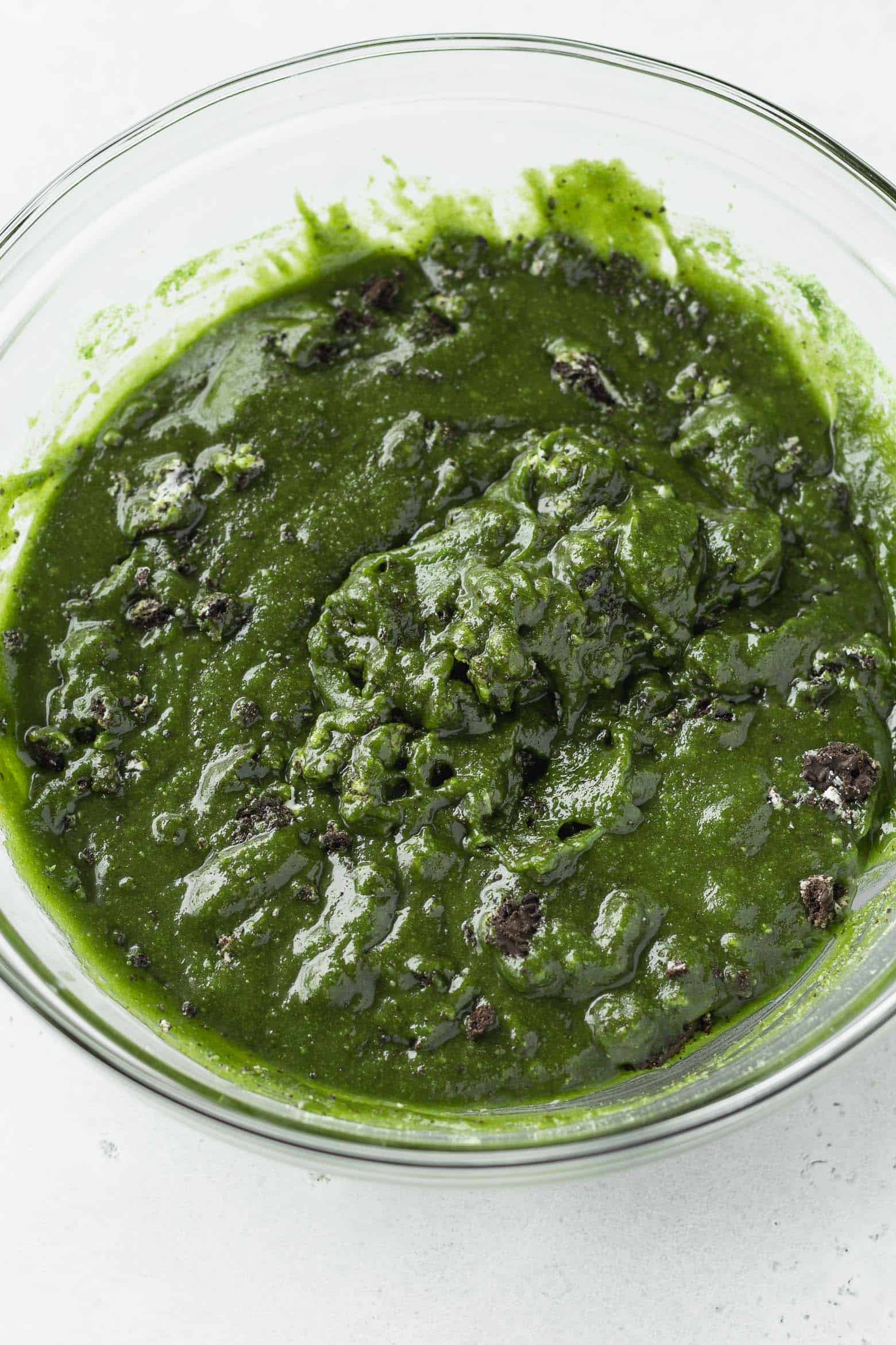 Matcha blondie batter in a glass bowl