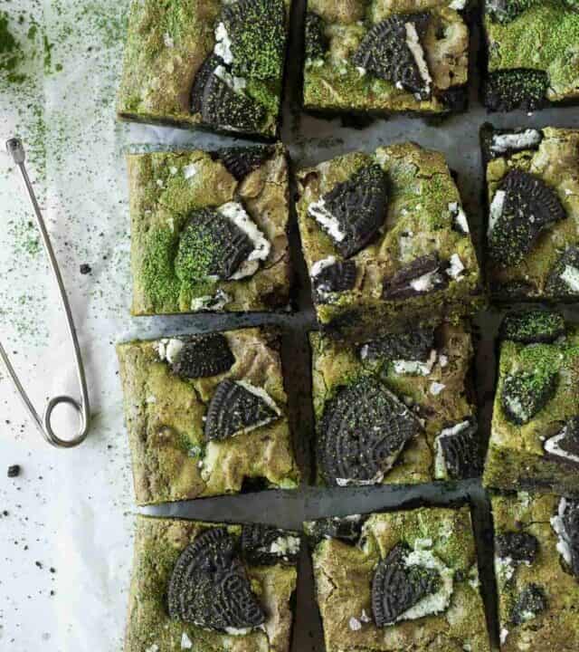 Squares of matcha blondies on a parchment paper