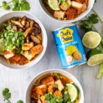 This vegan Thai red curry ramen is your new go-to quick and easy comfort food! Red curry paste and coconut milk make the perfect spicy and creamy soup for ramen noodles, deep fried tofu, and sautéed shiitake mushrooms. The scallions, cilantro, and lime juice tie it all together in this vegan fusion deliciousness! #veganrecipe #veganramen #thairedcurry #currypaste #coconutmilk