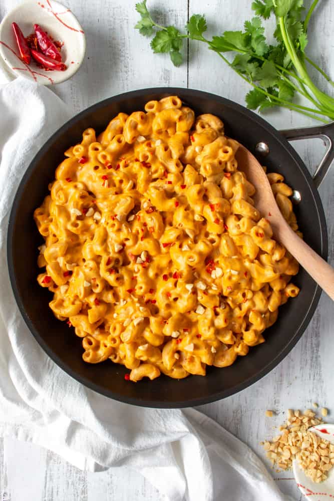 This vegan red curry mac and cheese is comfort food with a kick! The addition of Thai red curry paste and lime juice gives this creamy vegan mac and cheese a spicy tang! #thaicurry #redcurry #vegan #macandcheese #macncheese #vegancheese