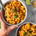This vegan red curry mac and cheese is comfort food with a kick! The addition of Thai red curry paste and lime juice gives this creamy vegan mac and cheese a spicy tang! #thaicurry #redcurry #vegan #macandcheese #macncheese #vegancheese