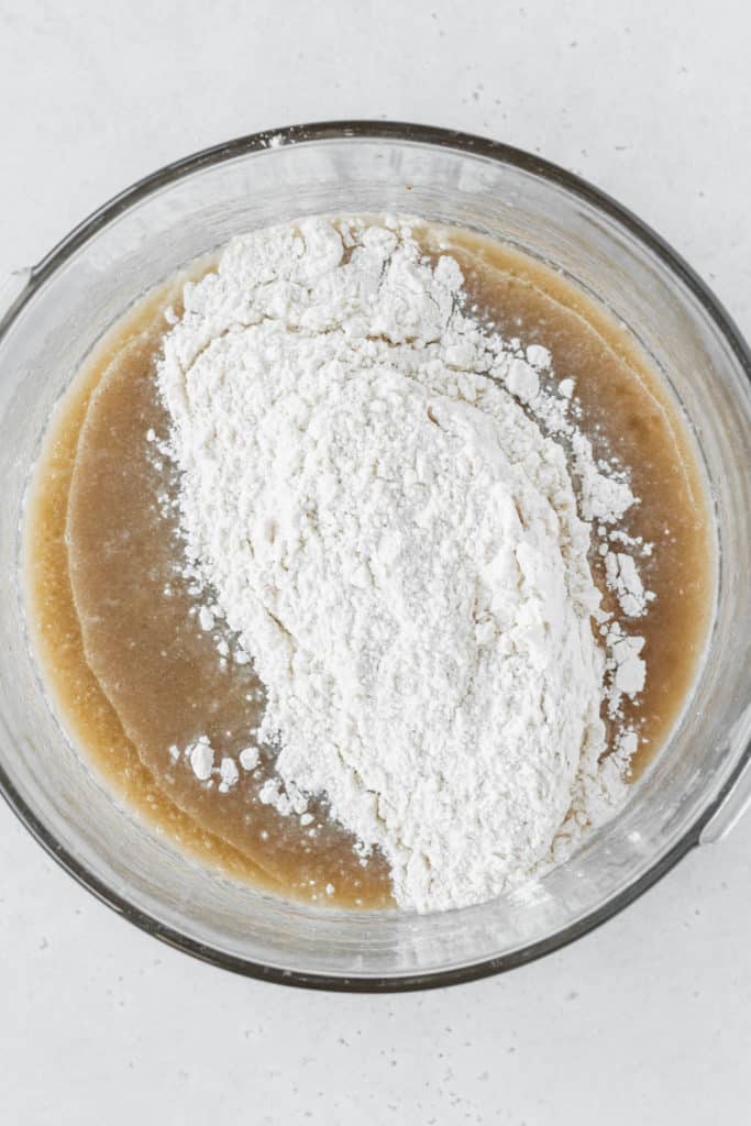 Wet ingredients and dry ingredients mixed together in a bowl.