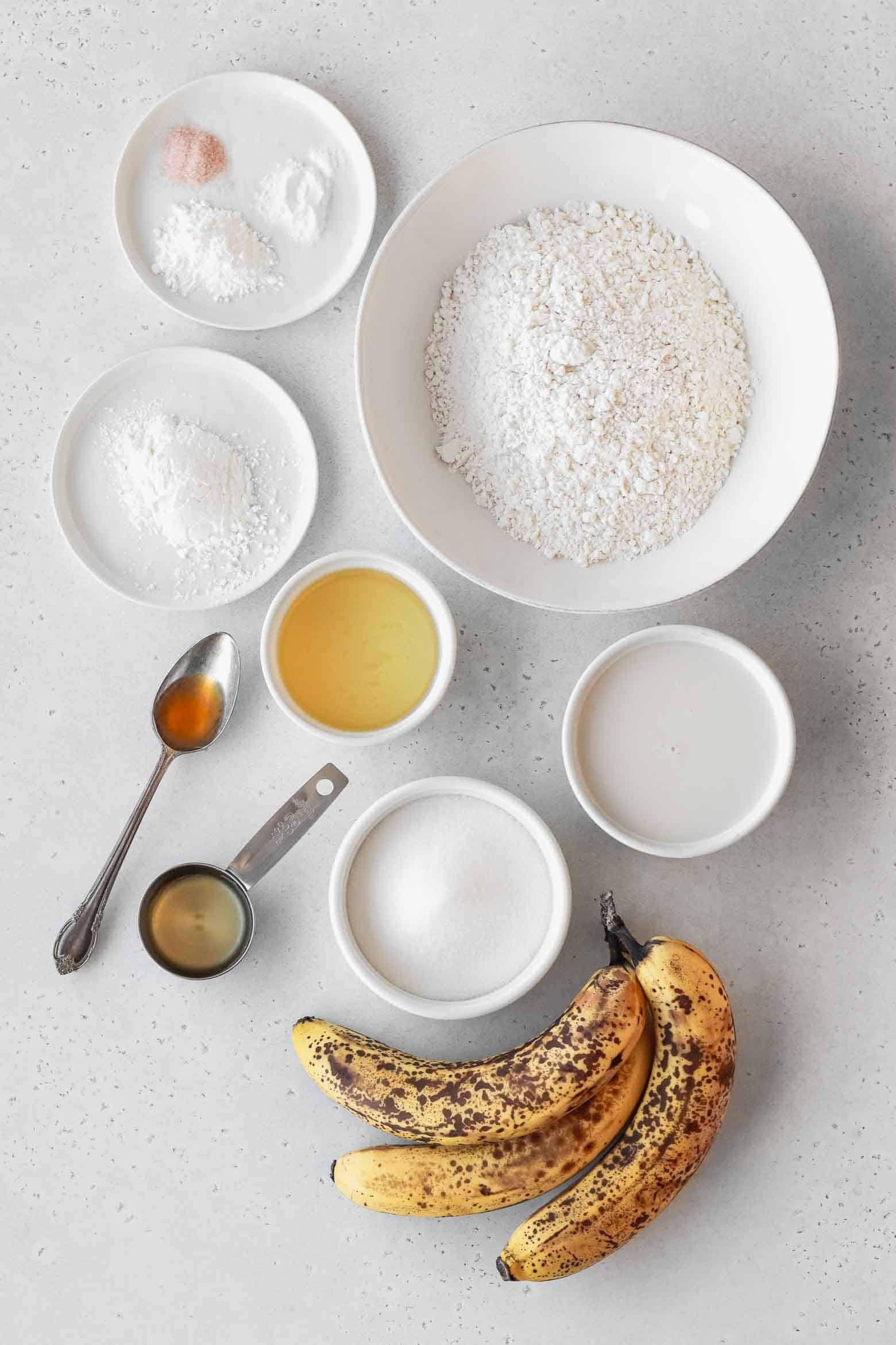 Ingredients to make homemade banana cupcakes measured out into bowls.