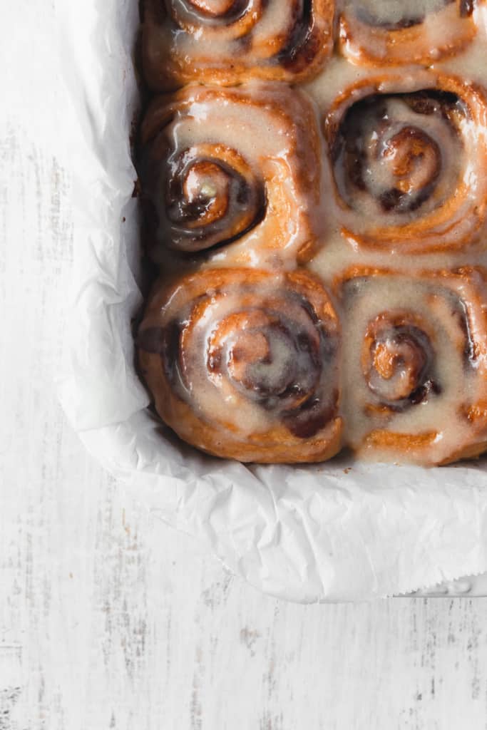 These vegan cinnamon rolls are super easy to make! So fluffy and topped with a cashew cream cheese icing, these vegan cinnamon buns are loved by everyone! #vegancinnamonrolls #cinnamonrolls #cinnamonbuns #veganrecipe #easyrecipe