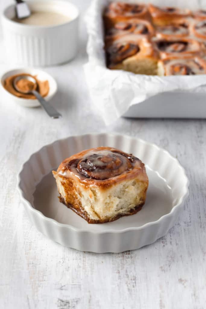 These vegan cinnamon rolls are super easy to make! So fluffy and topped with a cashew cream cheese icing, these vegan cinnamon buns are loved by everyone! #vegancinnamonrolls #cinnamonrolls #cinnamonbuns #veganrecipe #easyrecipe