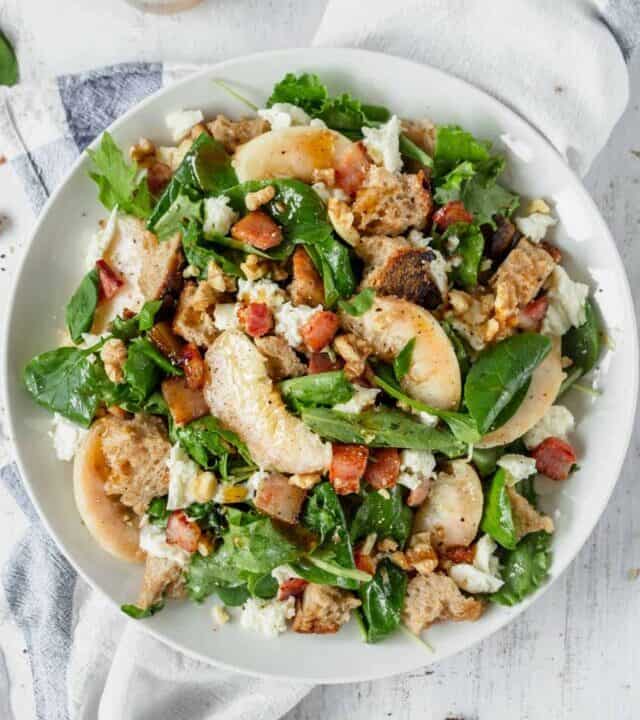 This peach panzanella with honey vinaigrette is a fruity twist on the classic Italian salad! It uses fresh peaches, mozzarella, and sourdough bread!