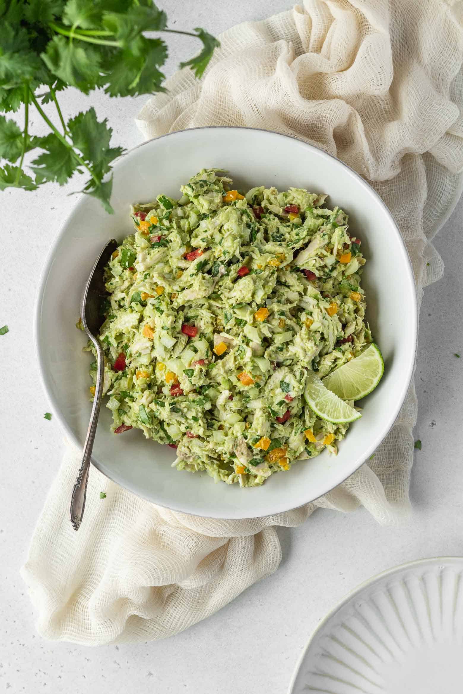 A bowl of chicken and avocado salad
