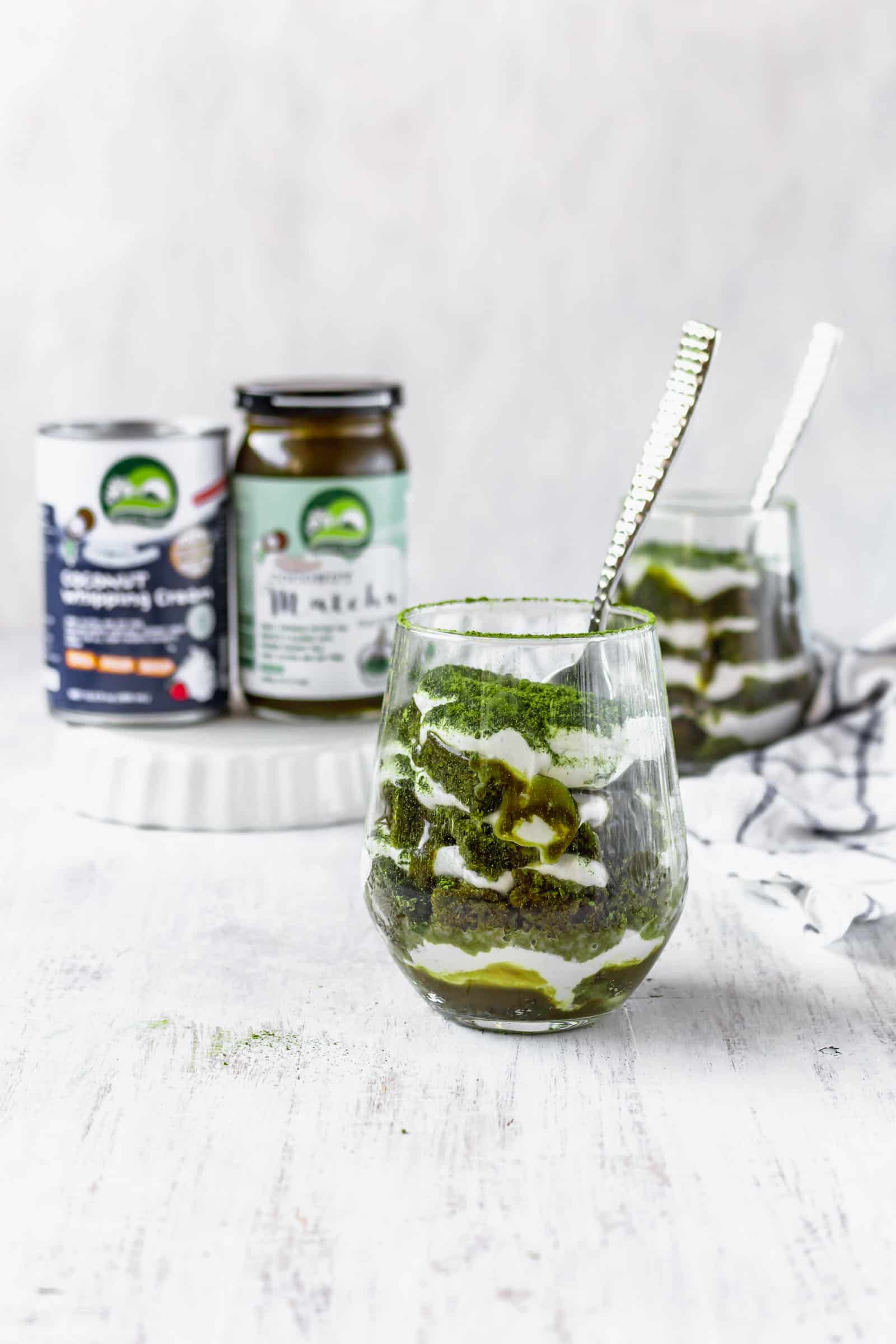 Vegan matcha tiramisu is a Japanese twist on a classic Italian dessert! This recipe has layers of matcha cake, matcha sauce, and coconut whipped cream! #matchadessert #vegantiramisu #matchatiramisu #vegandessert #coconutwhippedcream