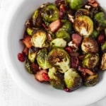 Brussels sprouts that don't suck and are actually delicious! Brussels sprouts are roasted with bacon, dried cranberries, and pecans. #roastedbrusselssprouts #brusselssprouts #thanksgivingsidedish #thanksgivingdinner #sprouts
