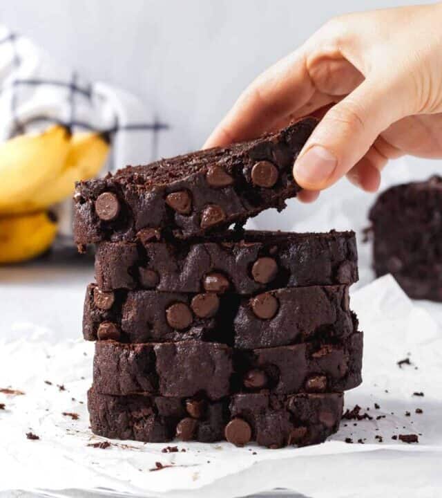 Somewhere between fudgy chocolate brownies and banana bread, this double chocolate banana bread is super moist, rich, and a killer recipe! #chocolatebananabread #doublechocolate #chocolatechips #moist #loafcake