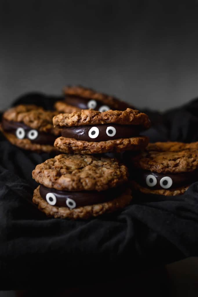 Chocolate fudge sandwiched between two oatmeal cookies make for a delicious and spooky treat!