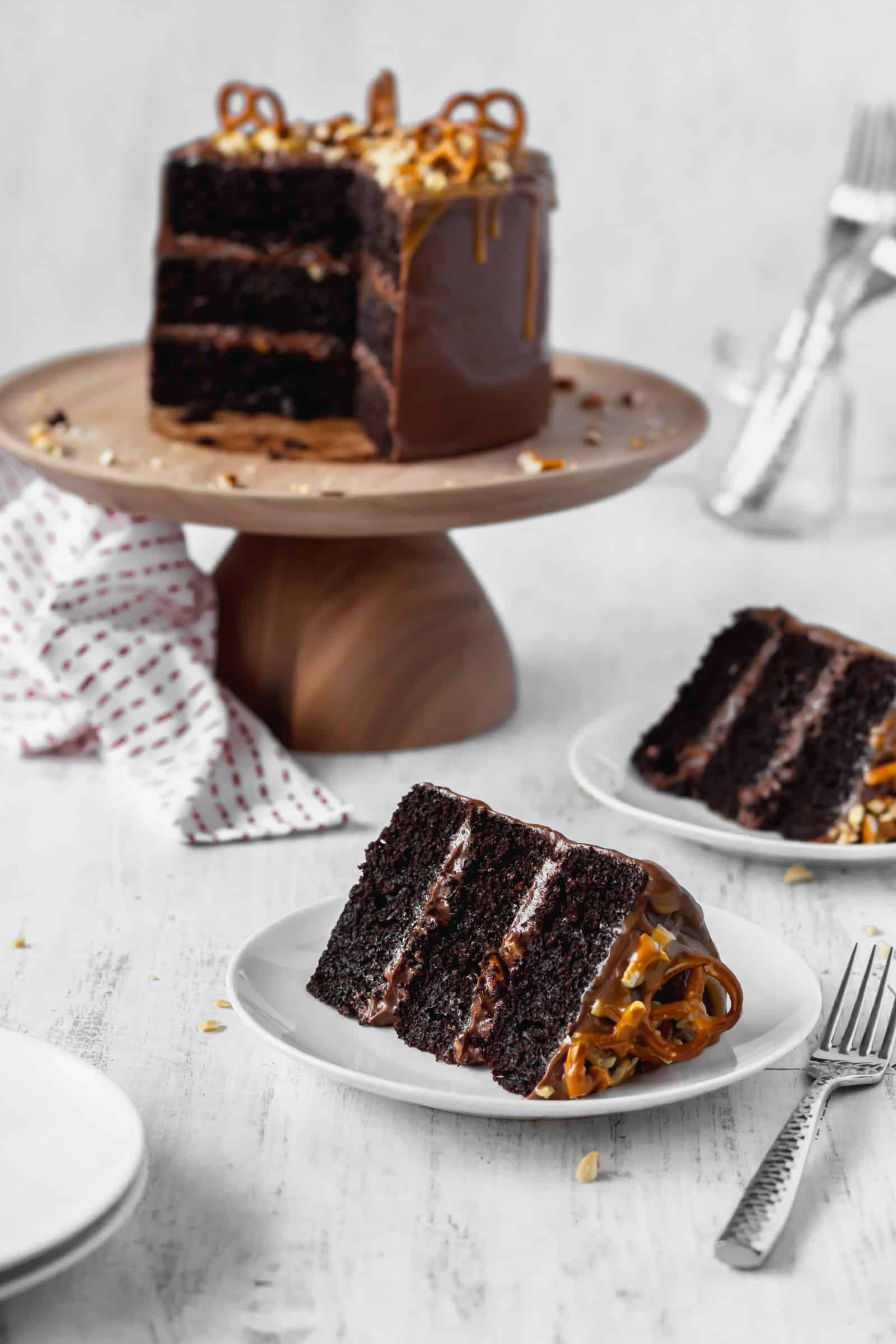 Chocolate cake sliced and served on plates with a fork