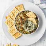 This vegan spinach and artichoke dip is dairy-free and gluten-free but full of creamy coconut milk, and cheesy cashews and nutritional yeast! #spinachdip #artichokedip #spinachandartichoke #dip #vegandip #veganappetizer #holidayappetizer