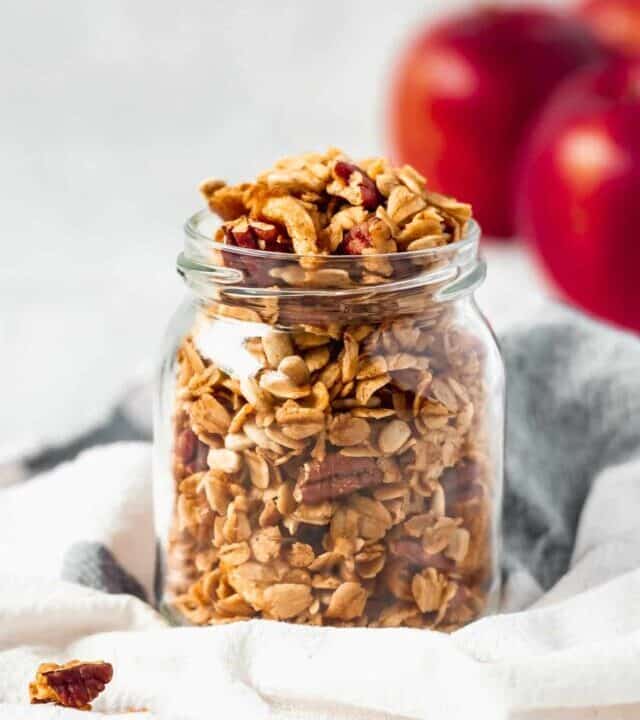 A fun twist on classic granola by adding apples and apple pie spice! A healthy breakfast while enjoying the comforting flavors of apple pie! #applepiegranola #cinnamonapplegranola #applegranola #homemadegranola #healthygranola
