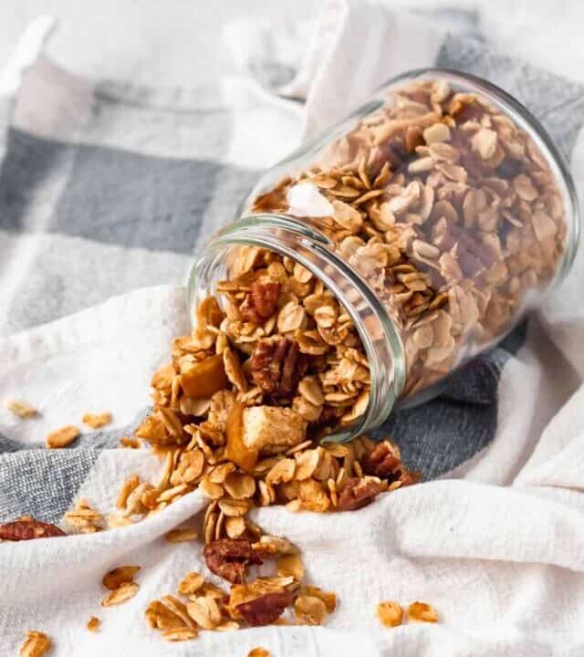 A fun twist on classic granola by adding apples and apple pie spice! A healthy breakfast while enjoying the comforting flavors of apple pie! #applepiegranola #cinnamonapplegranola #applegranola #homemadegranola #healthygranola