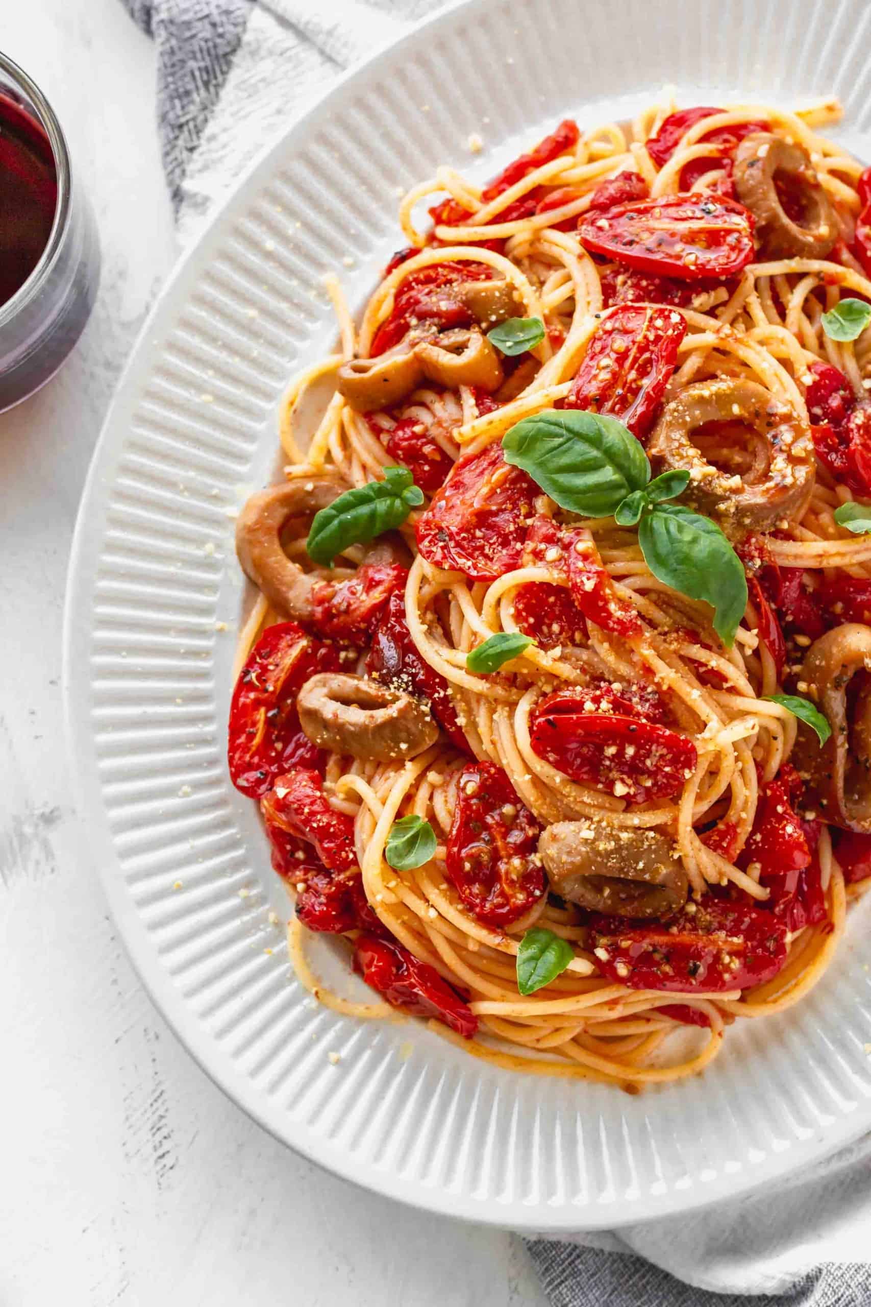 Plate of pasta with roasted tomatoes and vegan calamari