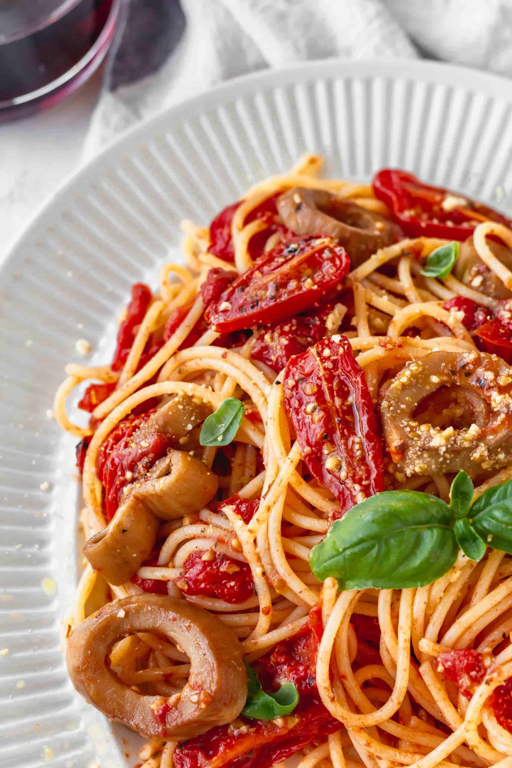 Close up of gluten-free spaghetti with roasted cherry tomatoes
