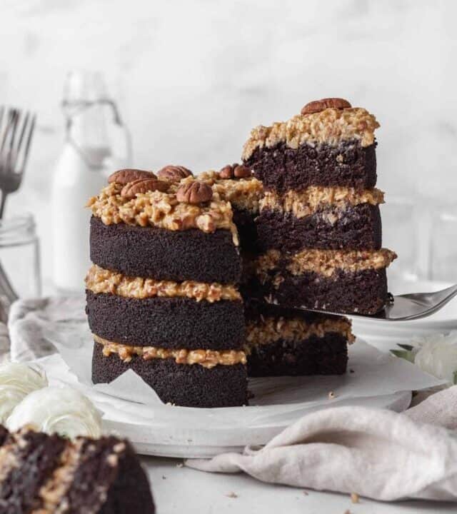 Dairy free German chocolate cake with a slice being taken out