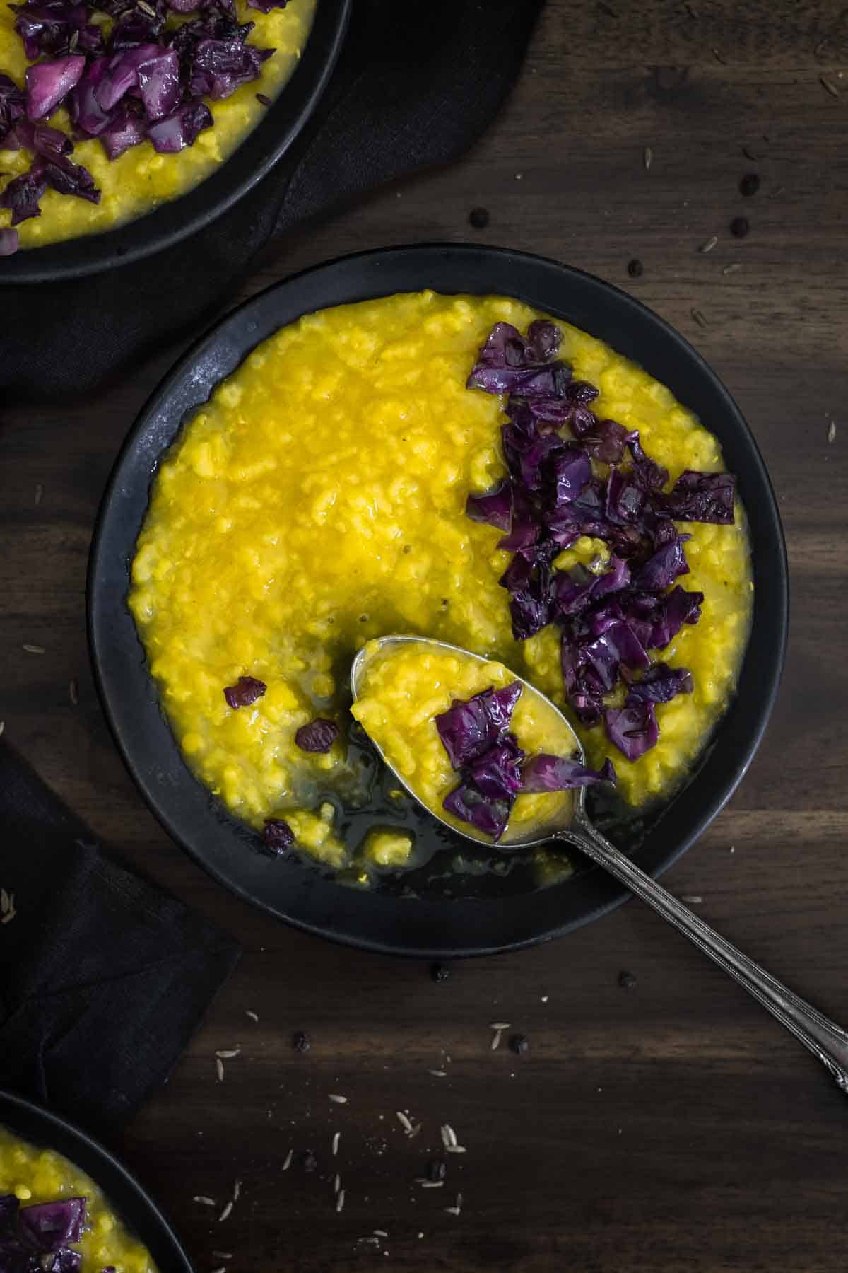 A bowl of rice porridge with a spoon
