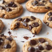 Close up shot of a dairy free gluten free chocolate chip cookie with a bite taken out.