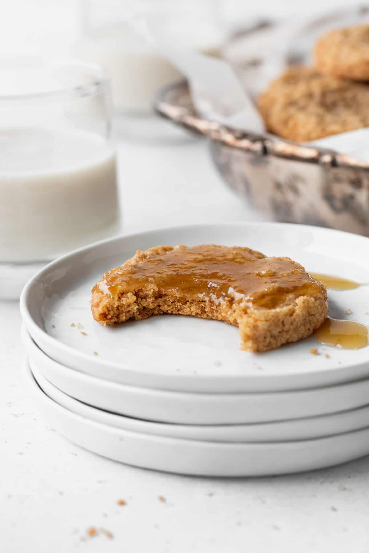 A gluten free ginger snap with a bite taken out.