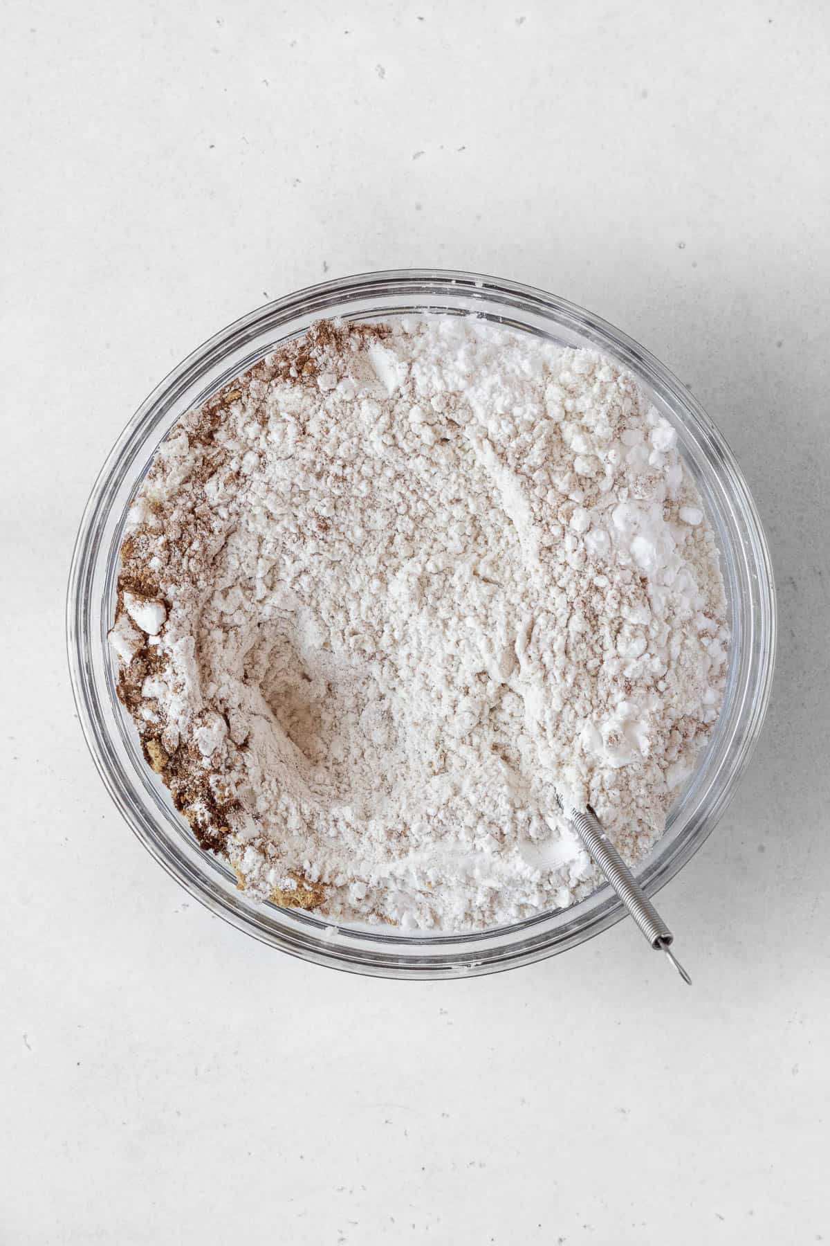 Flour and spices mixed together in a bowl.